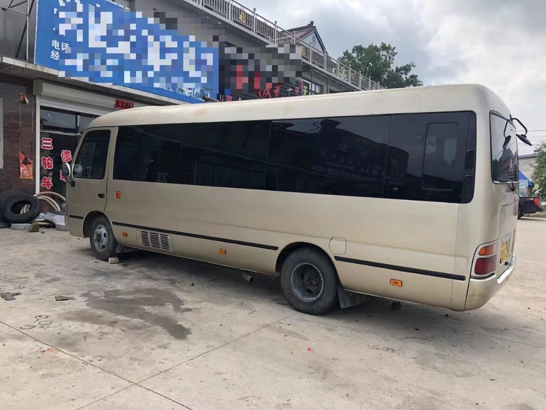 Toyota Mini Used Coaster Bus With a quitté à porte de passager 23 sièges 1Hz moteur diesel