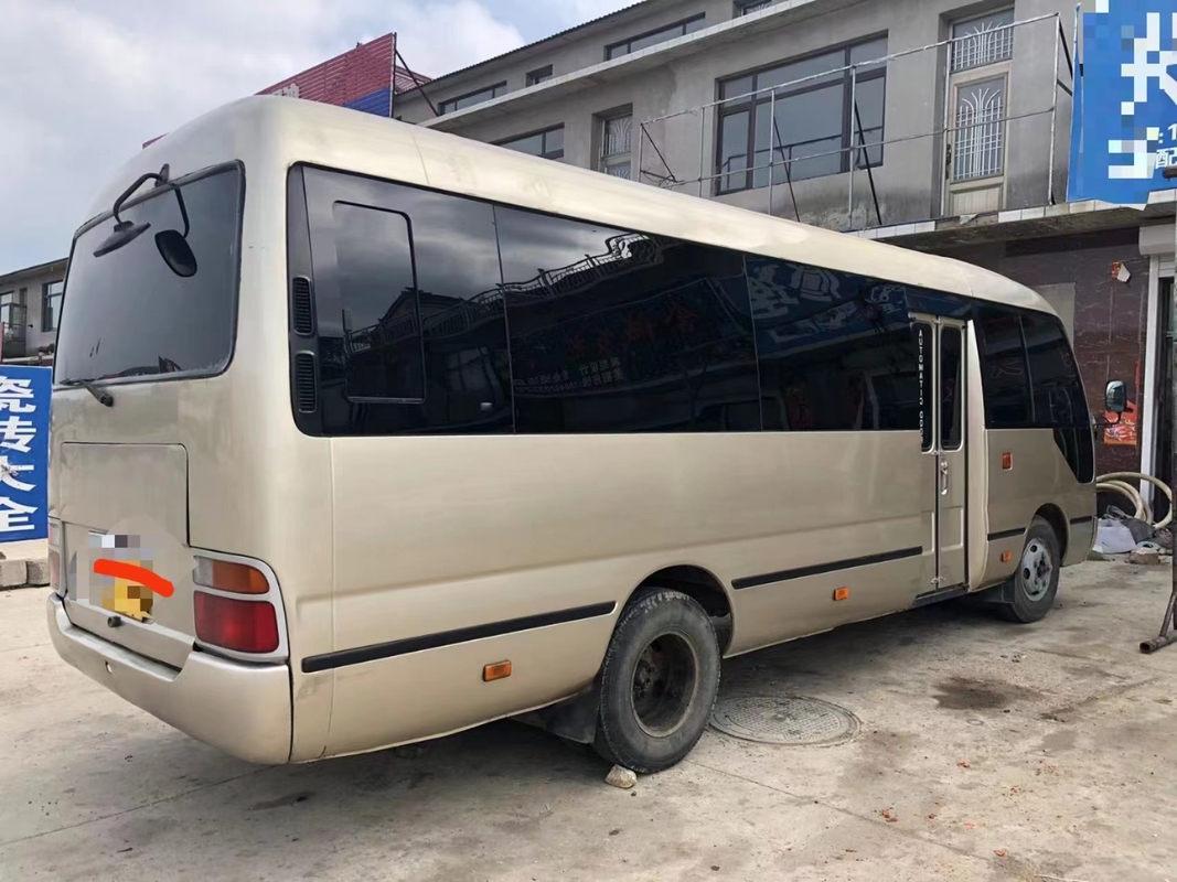 Toyota Mini Used Coaster Bus With a quitté à porte de passager 23 sièges 1Hz moteur diesel